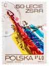 Stamp printed in the Poland shows Man and Woman, Sculpture by Wiera Muchina, 50th Anniversary of the Soviet Union