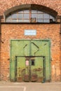 The Imperial Shipyard Trail - high gate of abandoned destroyed hall. Gdansk, Poland