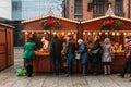 Poland, Katowice - December 03, 2018: Christmas Market at 4 Mickiewicza Street, people queuing at the stall to shop
