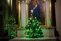 POLAND, KRAKOW - JANUARY 01, 2015: Side altar of The Church of St. Andrew with Christmas tree. Royalty Free Stock Photo