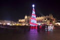 Poland, Krakow, Main Market square and Cloth Hall in winter, during Christmas fairs decorated with Christmas tree.