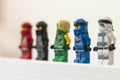 Poland - may 15th 2022: Portrait of Lego Ninjago Minifigures. City and people in background. Editorial illustrative