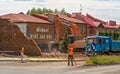 Poland Ostrowiec Swietokrzyski June 6, 2023 at 10:51. Big DOSAN excavator - demolition of the building.