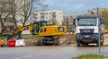 Poland Ostrowiec Swietokrzyski November 20, 2023 at 1:33 p.m. CAT wheeled excavator on a road construction site in the city.
