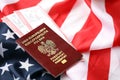 Poland passport with airline tickets on American US flag close up. Tourism and travel Royalty Free Stock Photo