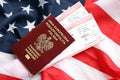 Poland passport with airline tickets on American US flag close up. Tourism and travel Royalty Free Stock Photo