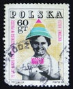 Poland postage stamp shows child holding symbolic stamp, 75 years philatelic movement in Poland, Krakow, T. Michaluk, circa 1968