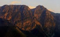 Poland, Tatra Mountains, Zakopane - panoramic view of Giewont and Szczerba peaks in Tatra Mountains in evening sunlight seen from