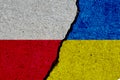 poland and ukraine flags painted over cracked wall