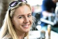 A poland young woman, 24 years, looking camera with sunglasses on forehead, smiling, outdoors