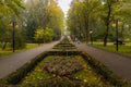 Beautiful and colorful well-kept spa park with old trees, flower beds, a fountain and a Royalty Free Stock Photo