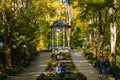 Beautiful and colorful well-kept spa park with old trees, flower beds, a fountain and a Royalty Free Stock Photo