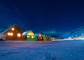 The polar arctic man Northern lights aurora borealis sky star in Norway Svalbard in Longyearbyen city moon mountains Royalty Free Stock Photo