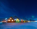 The polar arctic man Northern lights aurora borealis sky star in Norway Svalbard in Longyearbyen city moon mountains