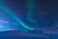 The polar arctic Northern lights aurora borealis sky star in Norway Svalbard in Longyearbyen city moon mountains
