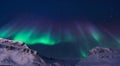 The polar arctic Northern lights aurora borealis sky star in Norway Svalbard in Longyearbyen city mountain
