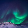 The polar arctic Northern lights aurora borealis sky star in Norway Svalbard Longyearbyen city snowscooter mountains Royalty Free Stock Photo