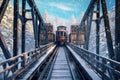 polar express train crossing a snow-covered iron bridge