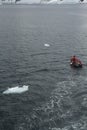 Polar landing boat with glaciers in background