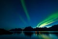 Dramatic aurora borealis, polar lights, over mountains in the North of Europe - Lofoten islands, Norway Royalty Free Stock Photo