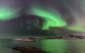 Polar lights, aurora borealis, northern lights and stars in the sky , Sommaroy, Vesteralen, Nordland, Norway Royalty Free Stock Photo