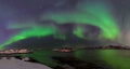Polar lights, aurora borealis, northern lights and stars in the sky , Sommaroy, Vesteralen, Nordland, Norway Royalty Free Stock Photo