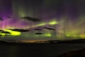 Dramatic aurora borealis, polar lights, over mountains in the North of Europe - Lofoten islands, Norway Royalty Free Stock Photo