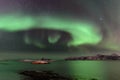 Polar lights, aurora borealis, northern lights and stars in the sky , Sommaroy, Vesteralen, Nordland, Norway Royalty Free Stock Photo