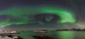 Polar lights, aurora borealis, northern lights and stars in the sky , Sommaroy, Vesteralen, Nordland, Norway Royalty Free Stock Photo