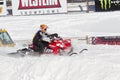 Polaris Red & Black Snowmobile Taking off