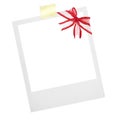 a polaroid card blank with red ribbon for Christmas .