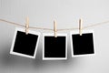 Polaroid frame.Retro photo frames hanging on rope  on white background. real photo Royalty Free Stock Photo