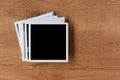 Polaroid photo frames on wooden background Royalty Free Stock Photo