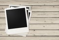 Polaroid photo frames on wooden background Royalty Free Stock Photo