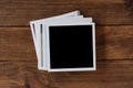 Polaroid photo frames on wooden background Royalty Free Stock Photo