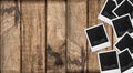 Polaroid photo frames wooden background. Wood table texture Royalty Free Stock Photo