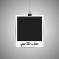 Polaroid picture hanging on the wall. Picture frame on gray. Pla Royalty Free Stock Photo
