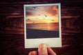 Polaroid postcard of beautiful sunset over ocean coastline with