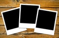 Polaroids frames over wooden boards Royalty Free Stock Photo