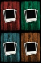 Polaroids over colorful grunge wooden walls Royalty Free Stock Photo