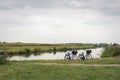 Dutch polder landscape with a stream and two bicycles Royalty Free Stock Photo