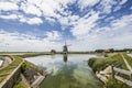 A polder and windmill `Het Noord` on Wadden Sea island Texel in the Netherlands with reflections in the water