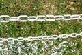 Pole chain on the grass. Royalty Free Stock Photo