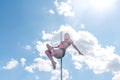 Pole dance fit woman exercising with pylon outdoors Royalty Free Stock Photo