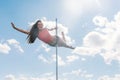 Pole dance fit woman exercising with pylon outdoors Royalty Free Stock Photo