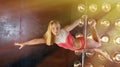 Blonde girl Pole dance Royalty Free Stock Photo