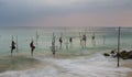 Pole fishermen on ocean coast in Sri Lanka Royalty Free Stock Photo