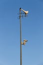 Pole with loudspeaker, radio antennas and surveillance camera Royalty Free Stock Photo