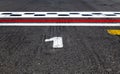 Pole position number one sign on asphalt race track, motor sports symbols