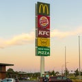 Pole sign with logoâs McDonalds, Burger King, KFC, de Beren, and New York Pizza